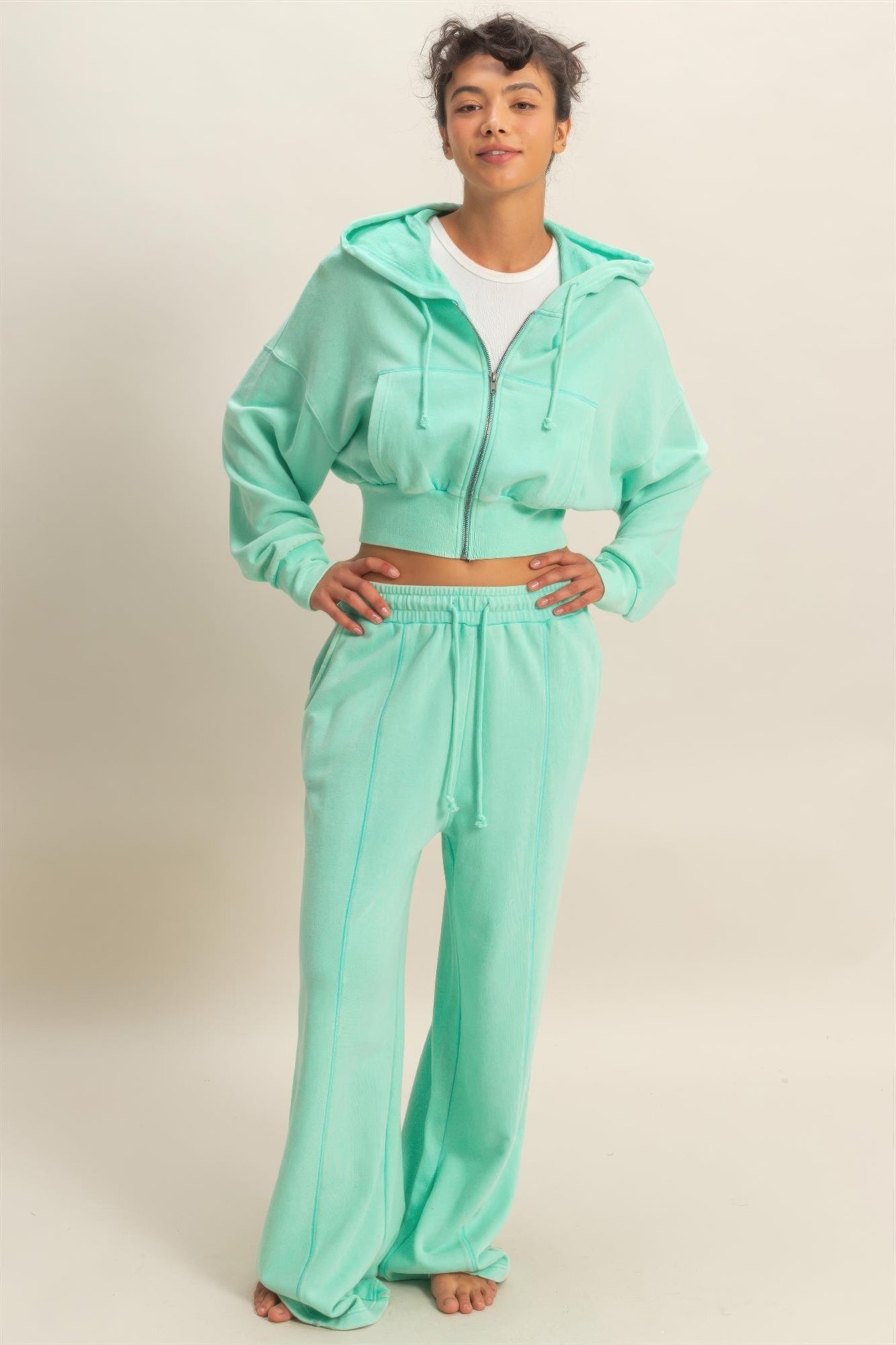 Person wearing a mint green jogger pants