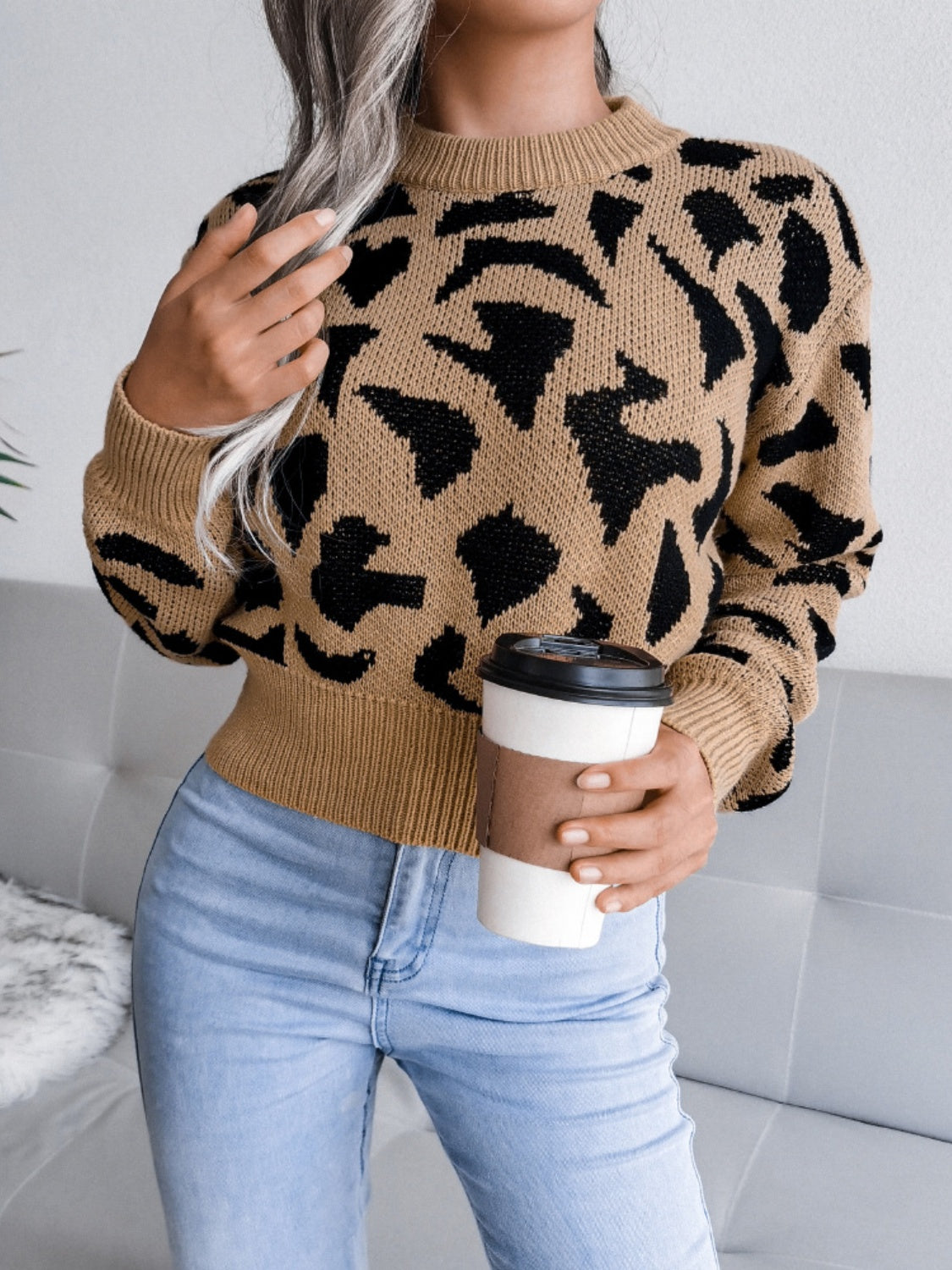 Model wearing a Camel Plush Women's Leopard Round Neck Dropped Shoulder Sweater Front view