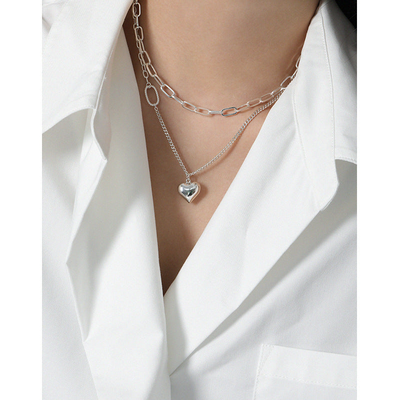 Model wearing Asymmetry Curb Chain Heart 925 Sterling Silver Necklace