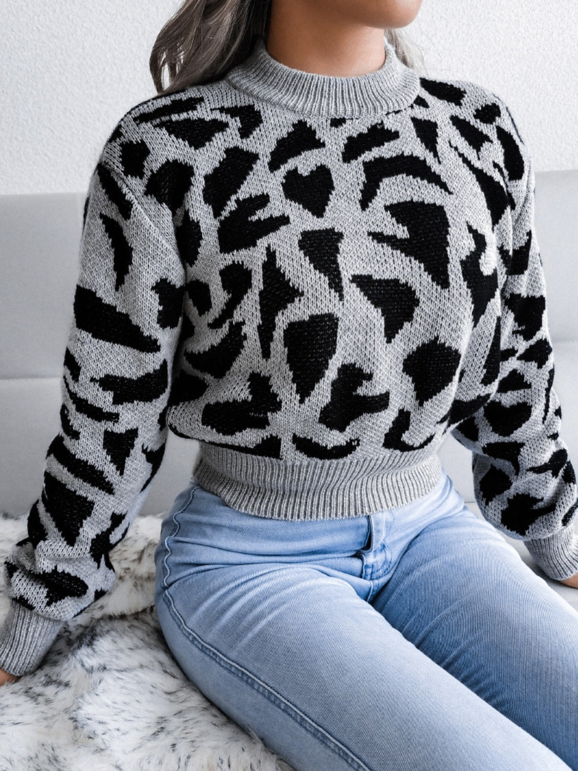 Model wearing a Grey Plush Women's Leopard Round Neck Dropped Shoulder Sweater Front view