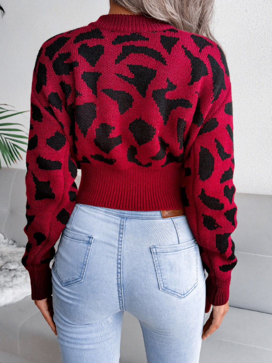 Model wearing a Rust Plush Women's Leopard Round Neck Dropped Shoulder Sweater Back view