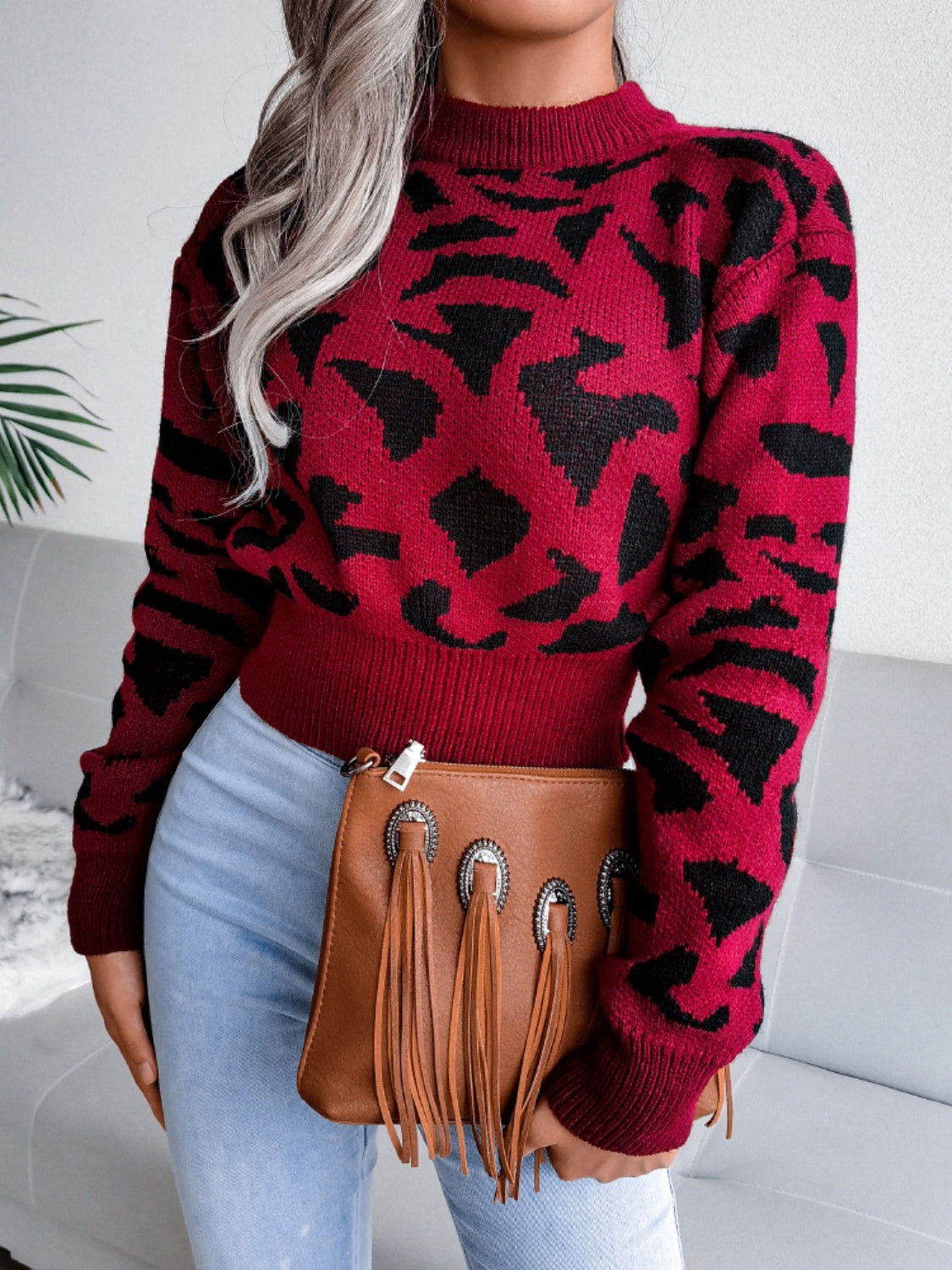 Model wearing a Rust Plush Women's Leopard Round Neck Dropped Shoulder Sweater Front view