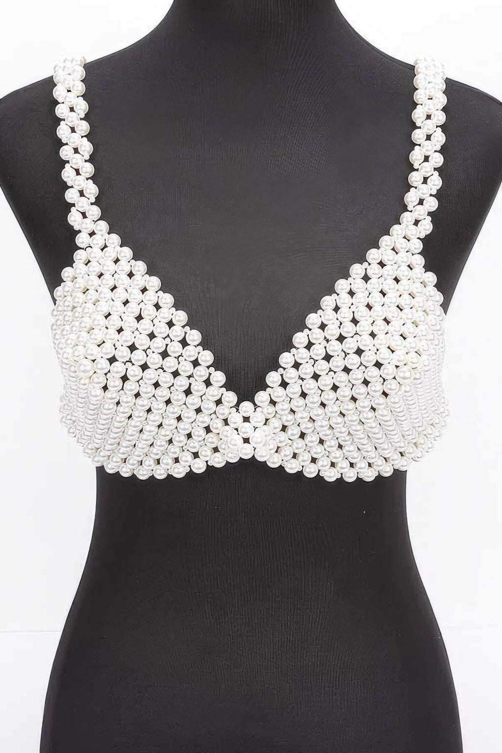 Pearl-studded bralette on a mannequin against a white background