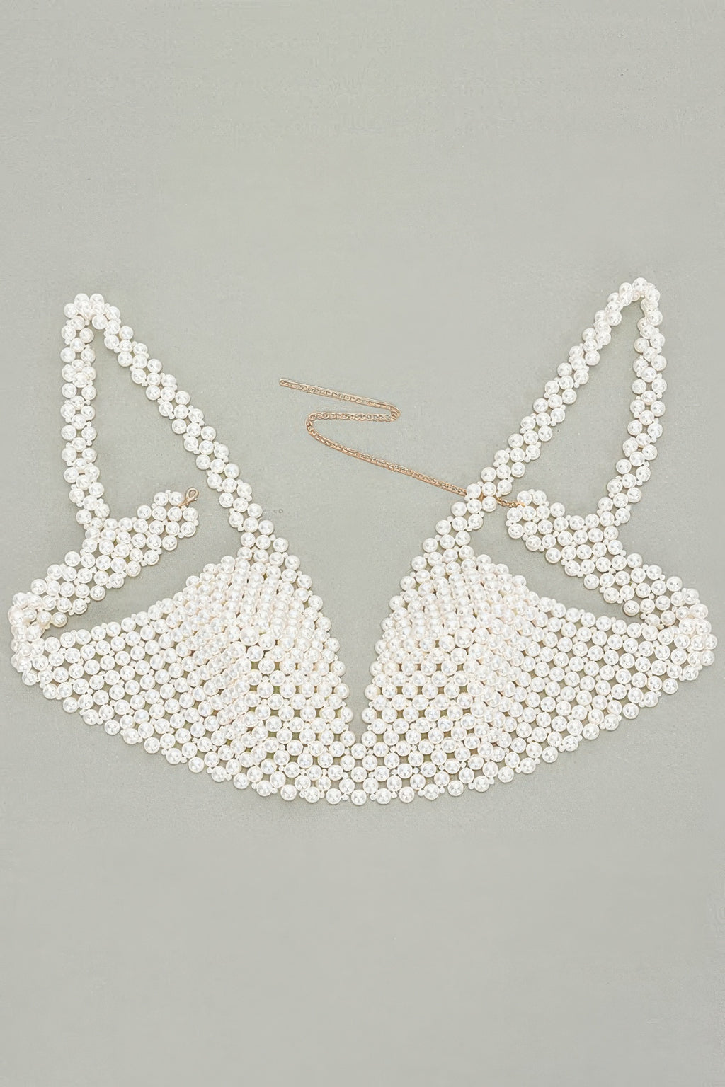 Pearl bikini set on a light gray background