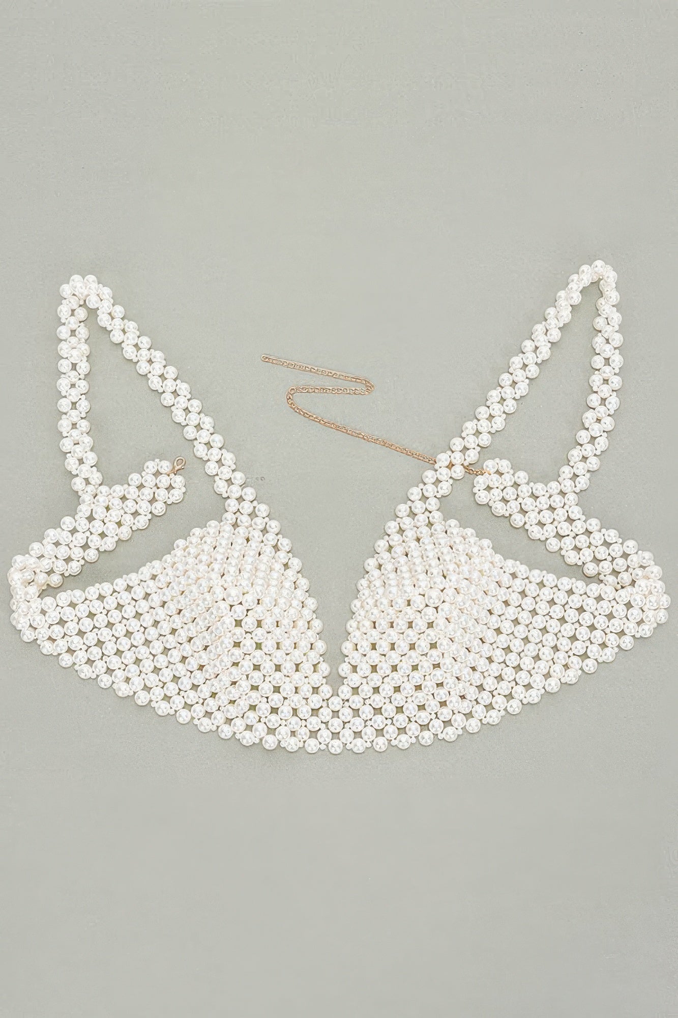 Pearl bikini set on a light gray background