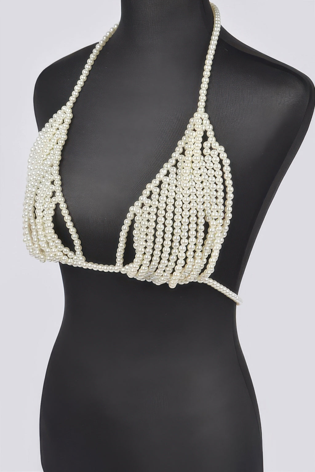 Pearl bikini top on a mannequin against a white background
