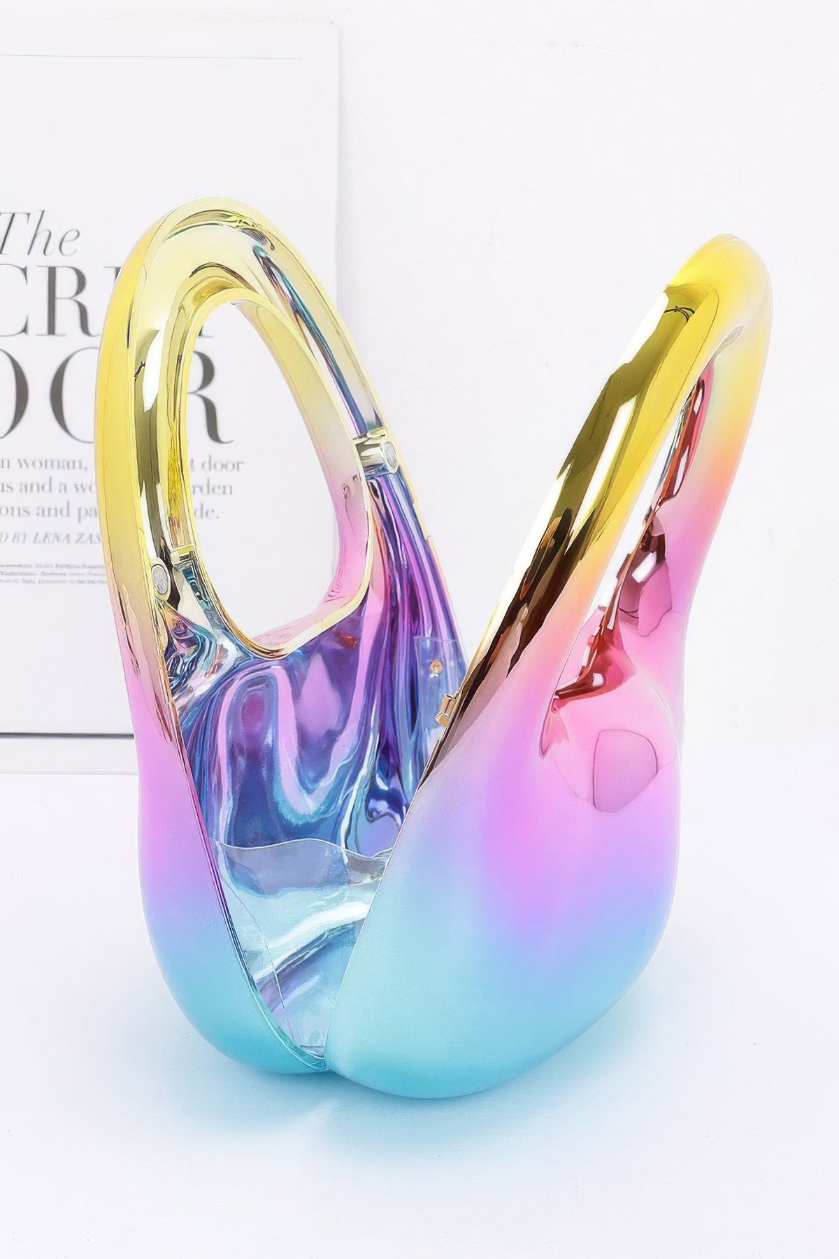 Gradient-colored earring on a light background open view