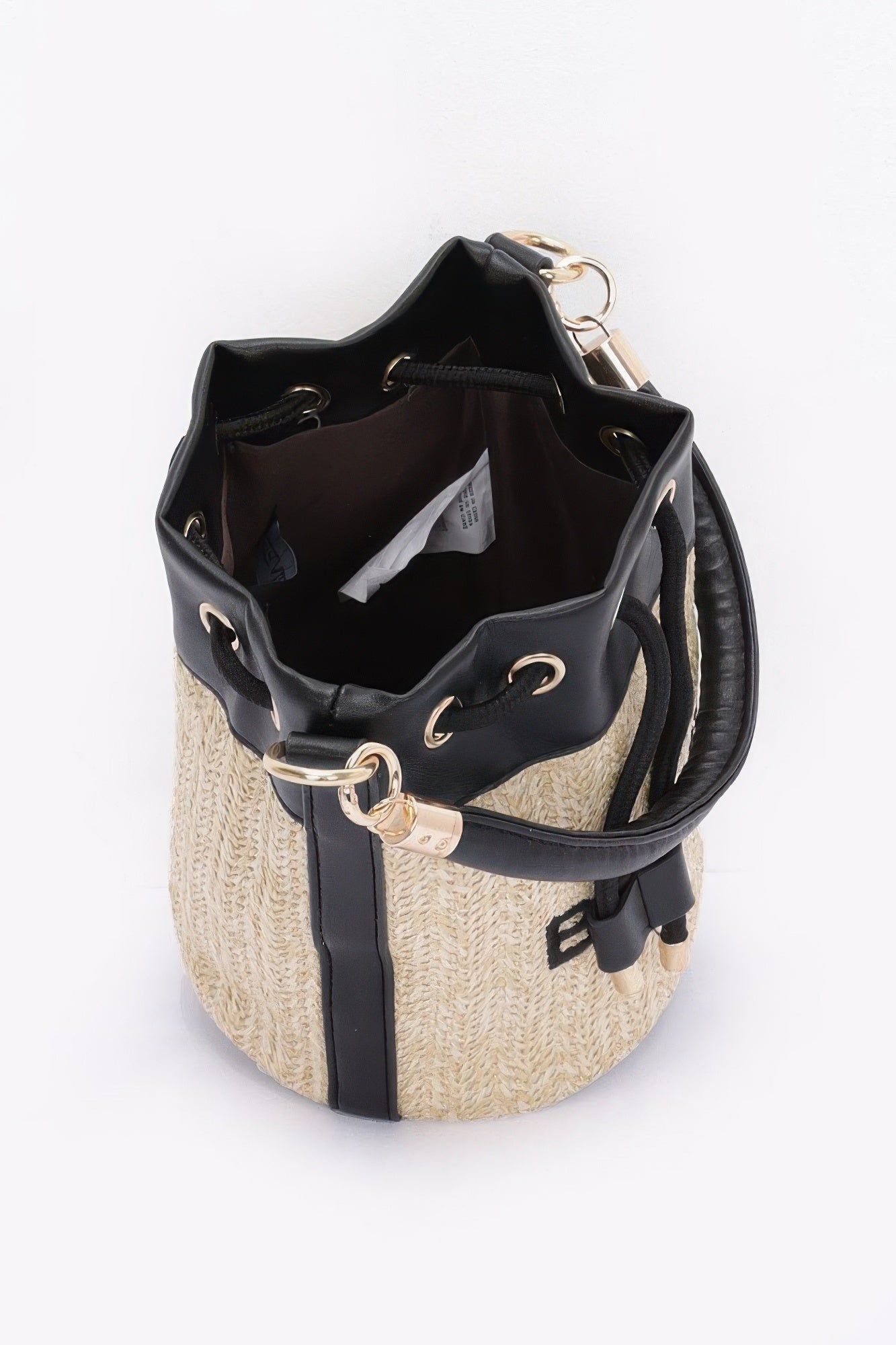 Black and beige bucket bag on a white background open view