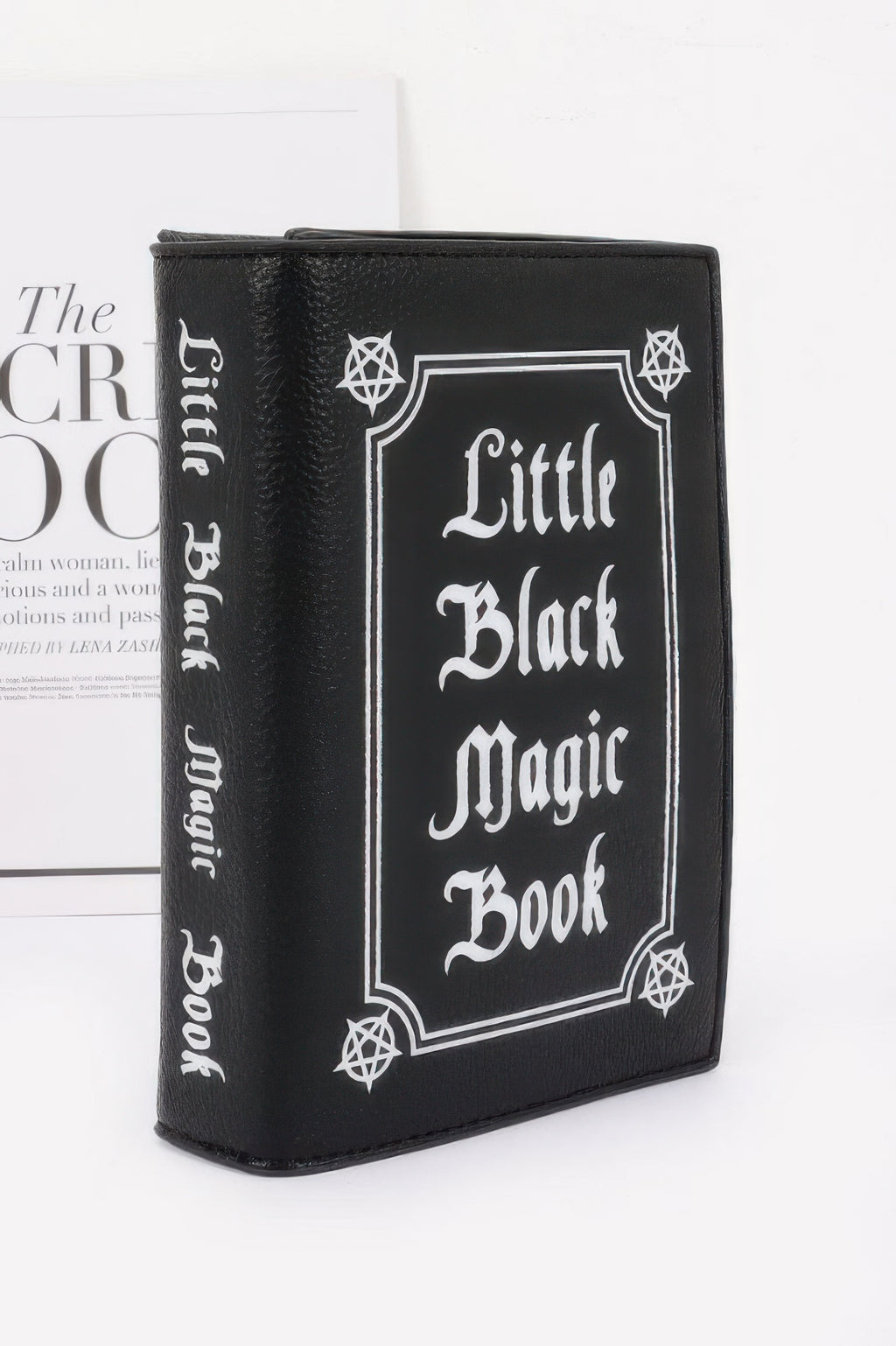 Black book-shaped wallet with 'Little Black Magic Book' text upright
