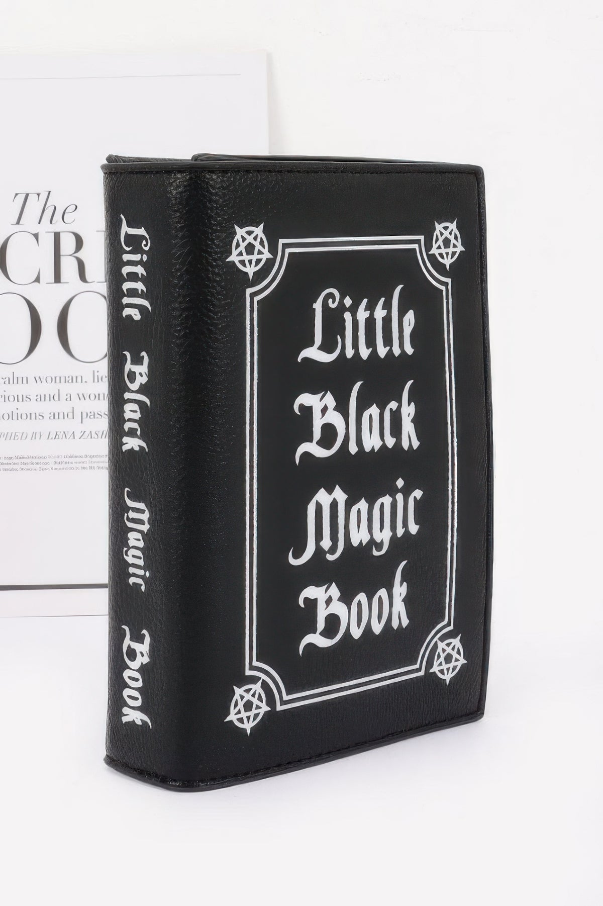 Black book-shaped wallet with 'Little Black Magic Book' text upright