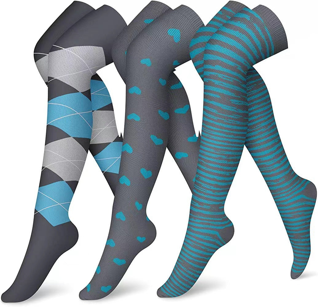 Three pairs of patterned knee-high socks on a white background