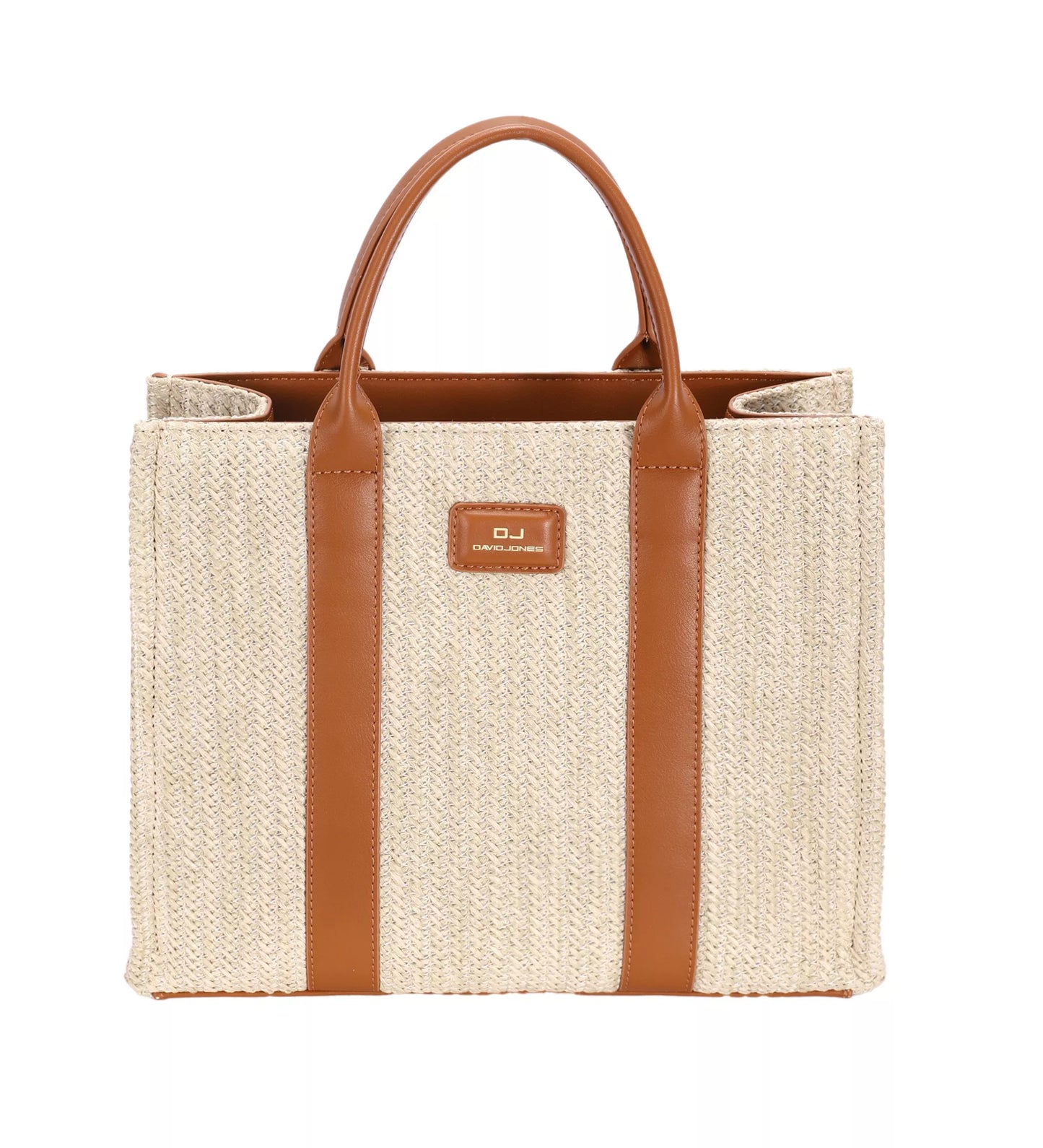 Beige straw tote bag with brown leather straps and handle on a white background