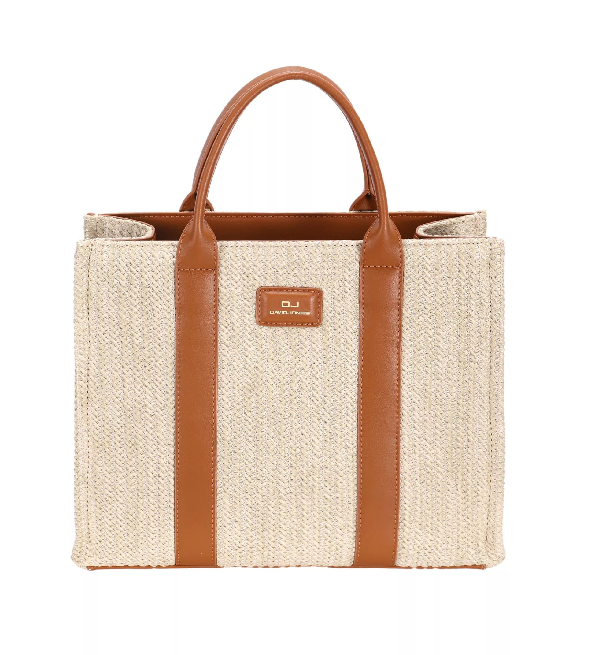Beige straw tote bag with brown leather straps and handle on a white background