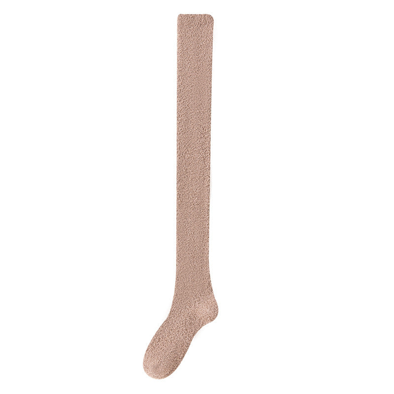 Beige knee-high sock on a white background