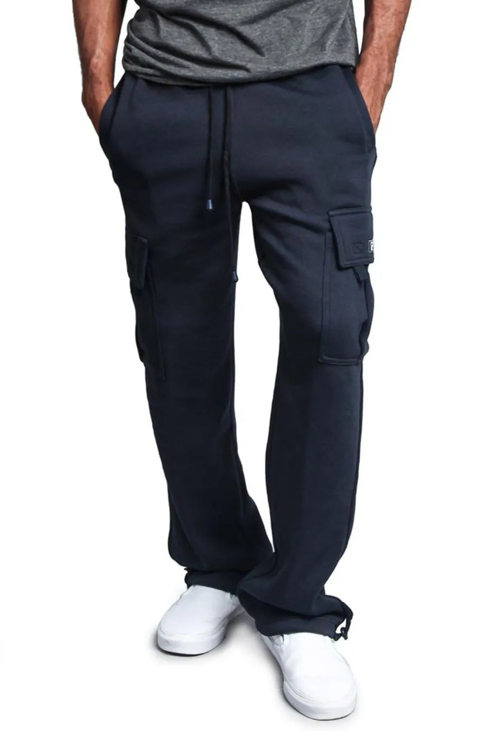 Male model wearing a pair of navy blue casual draw string cargo joggers pants 