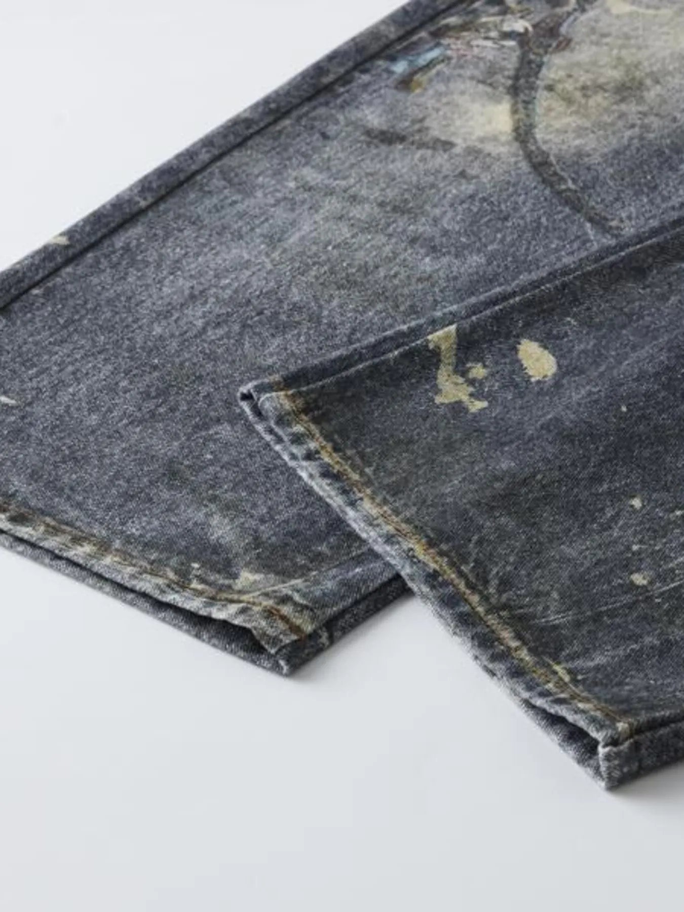  a pair of Modern Men's Distressed Printed Wide Leg Jeans hem detail view