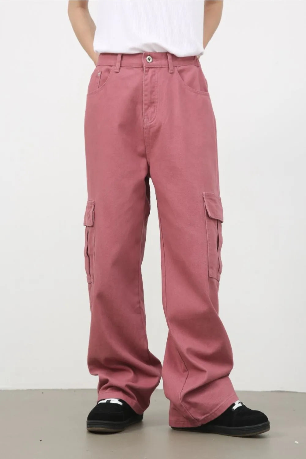 Male model wearing dusty pink Mid Rise Jeans with Cargo Pockets