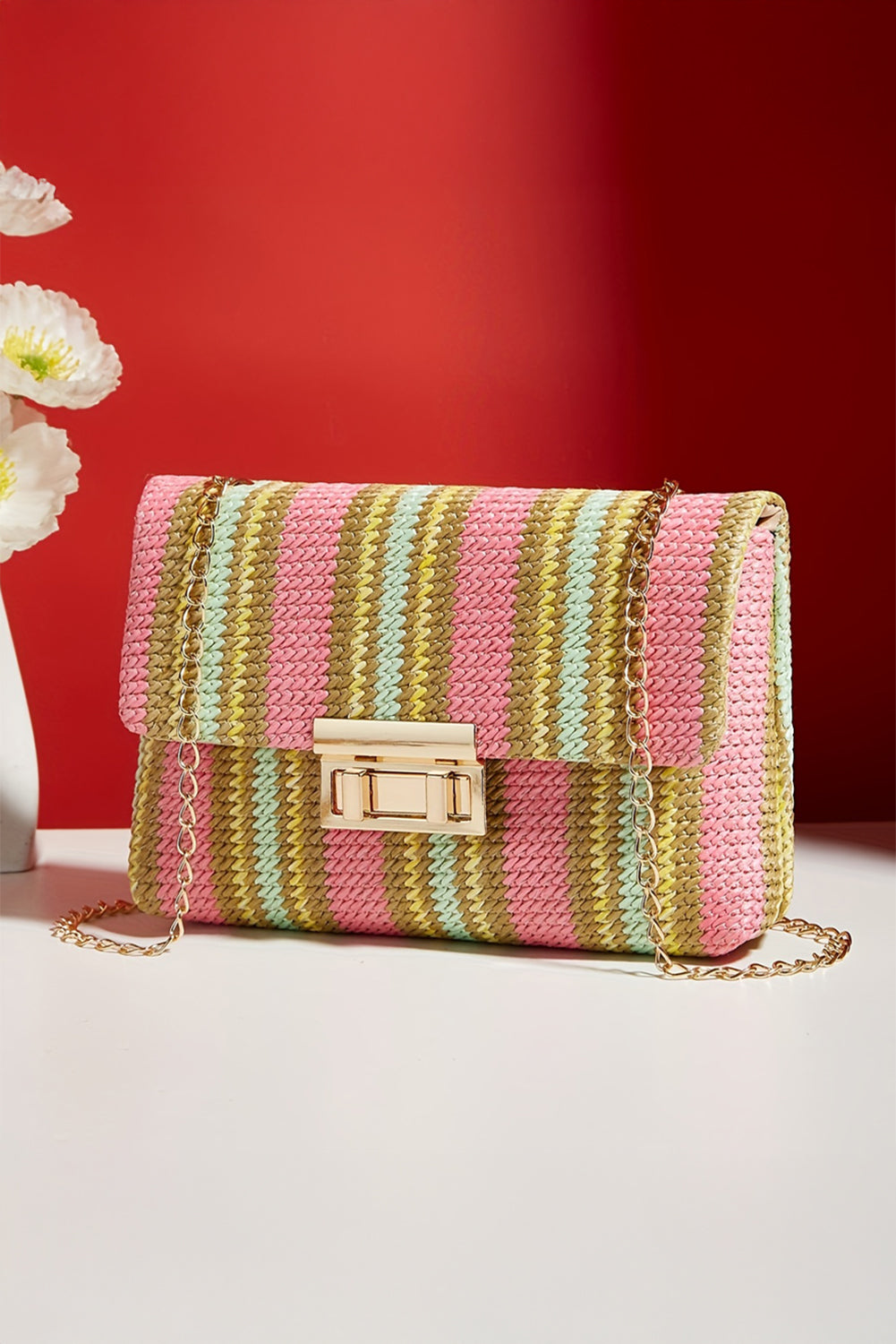 Colorful striped handbag on a red background