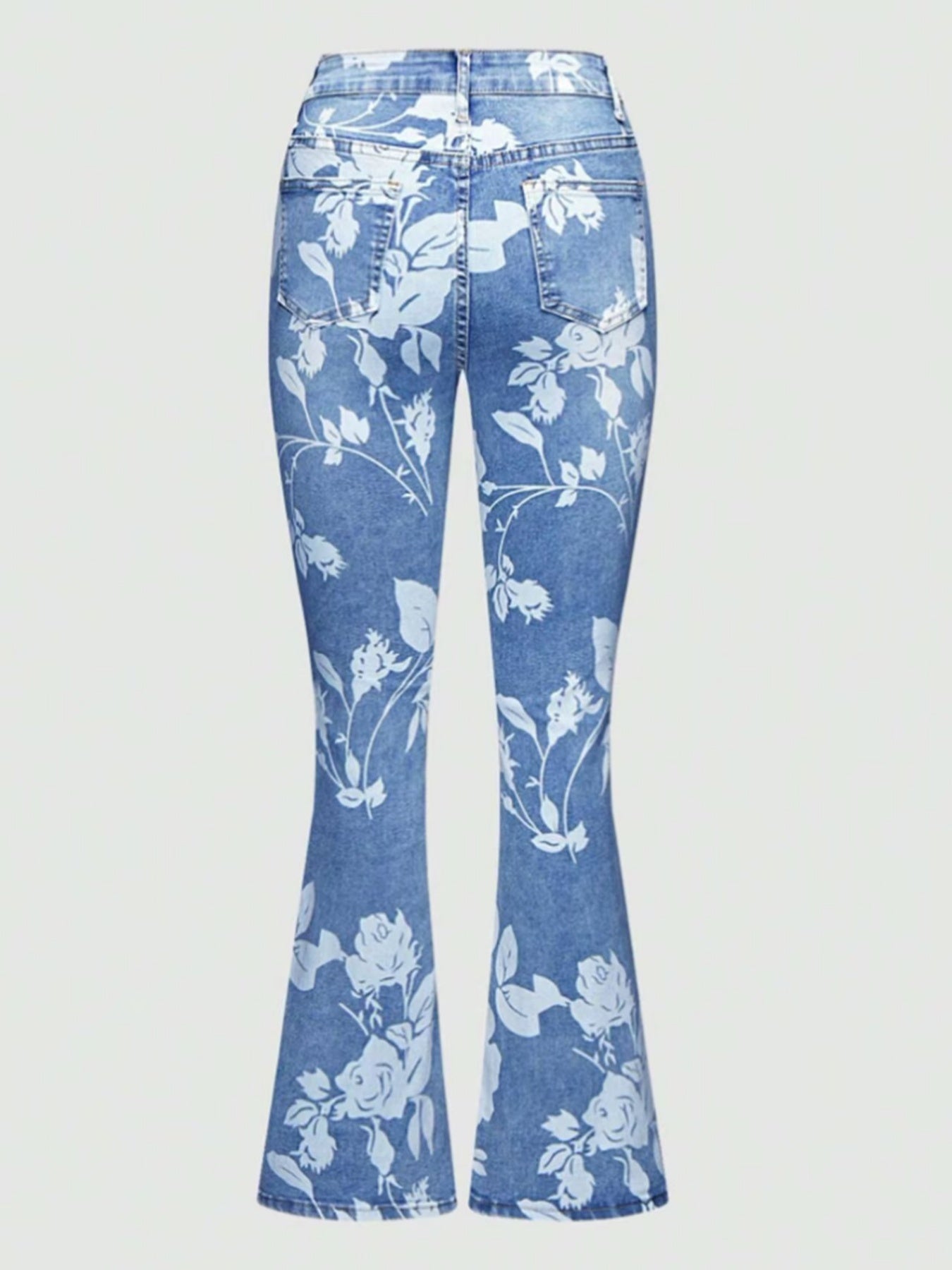 Flared jeans with floral pattern on a light gray background