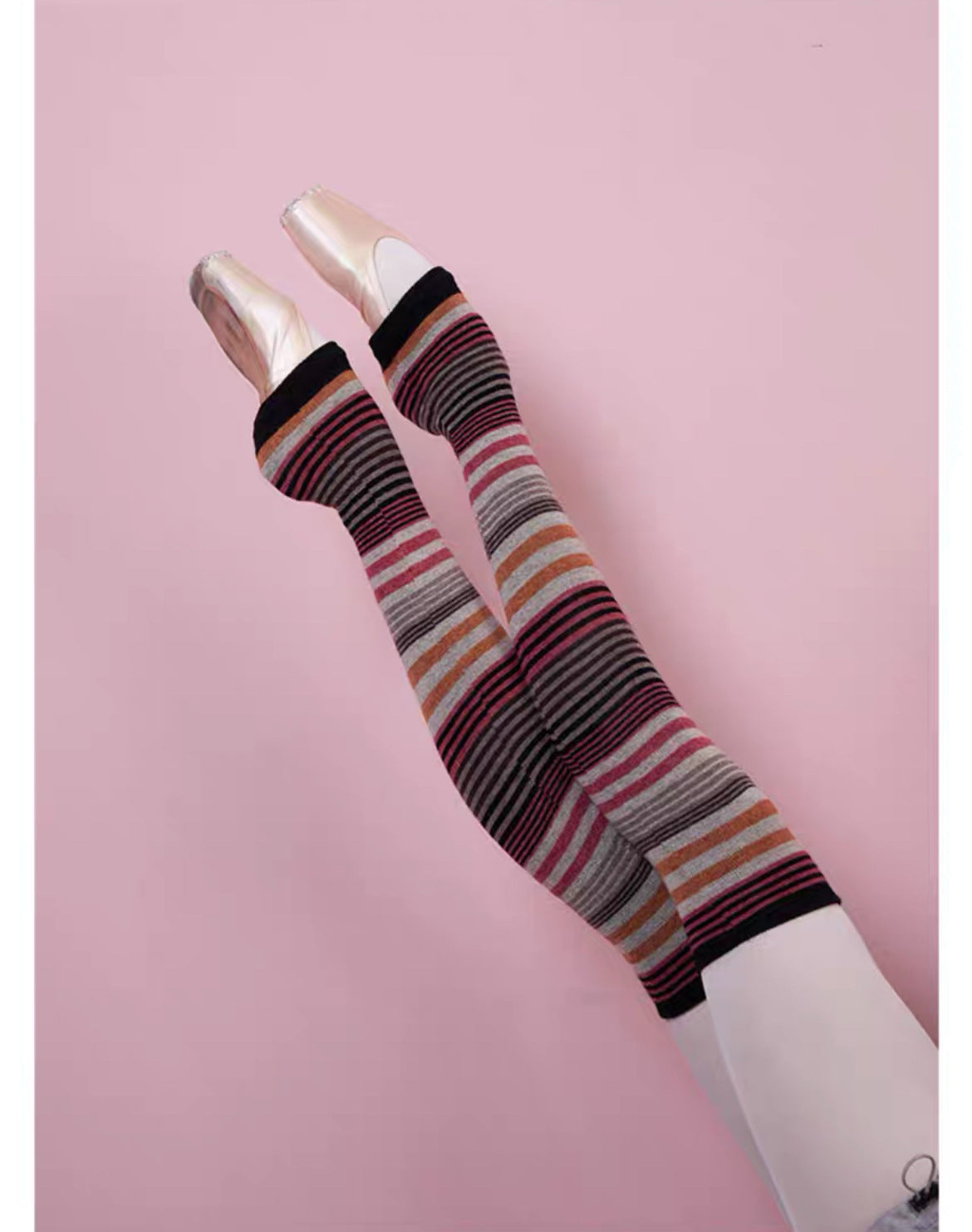 Striped knee-high socks on a pink background