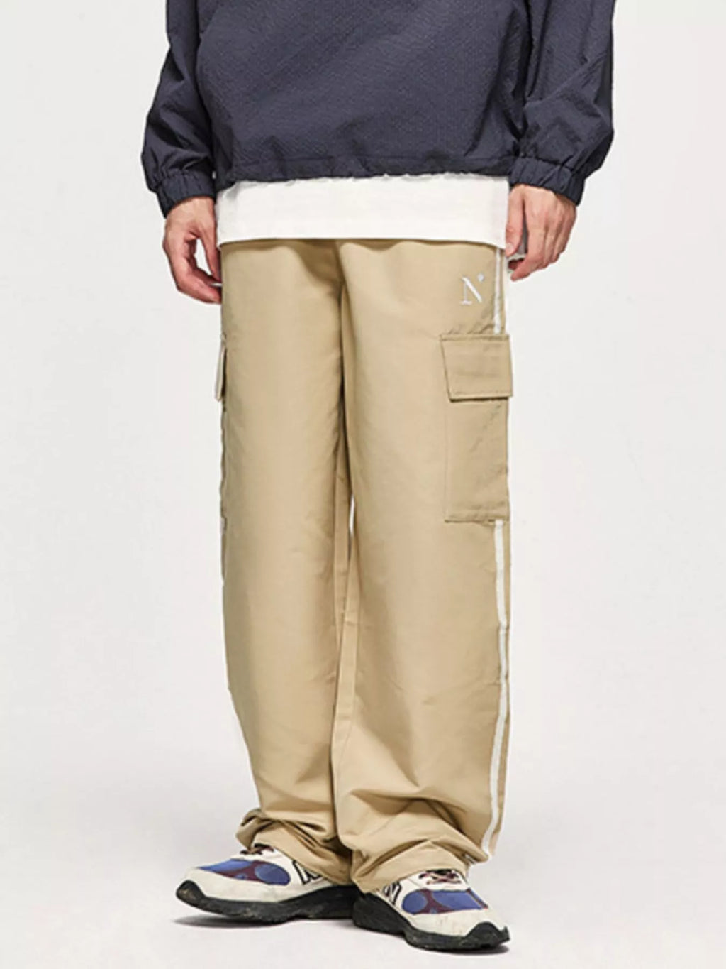 Model wearing khaki Men's Side Striped Cargo Pants