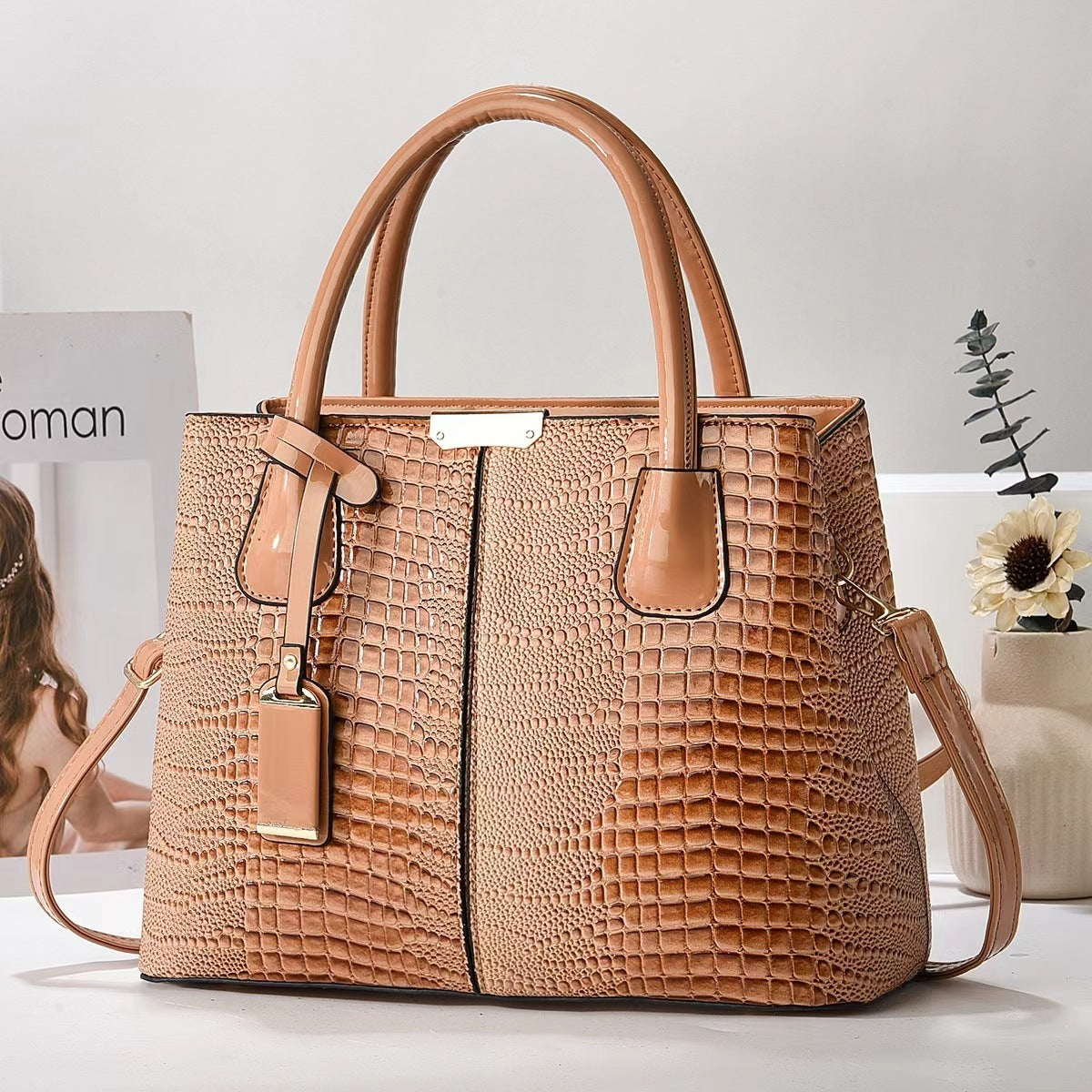 Brown textured handbag on a light background