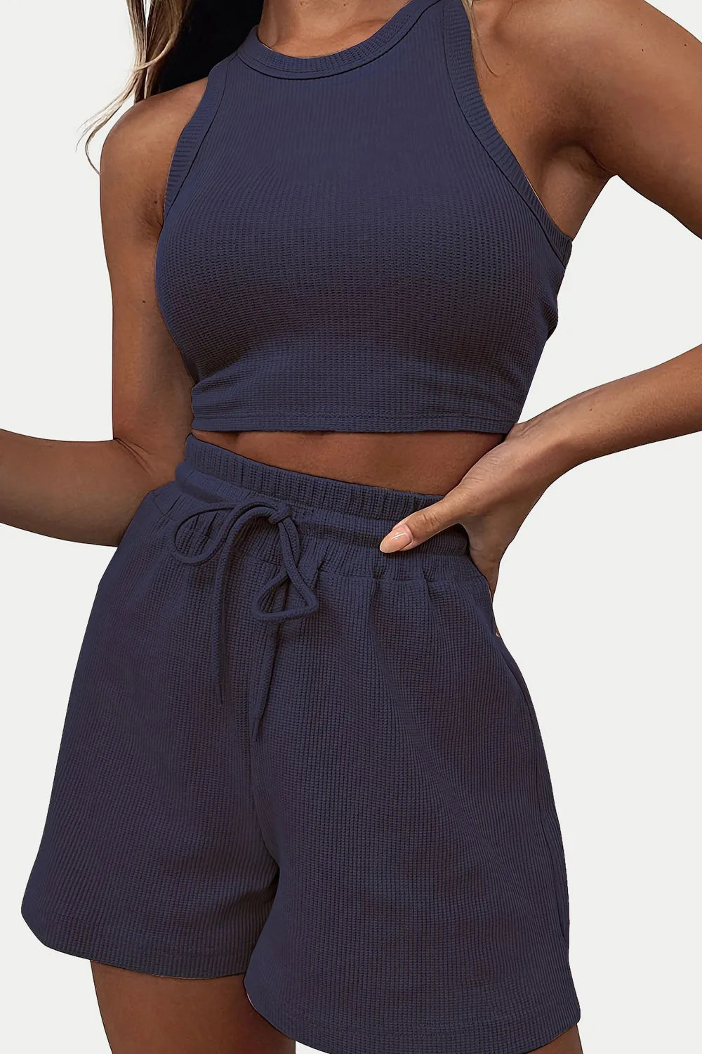 Navy blue ribbed tank top and shorts set on a neutral background