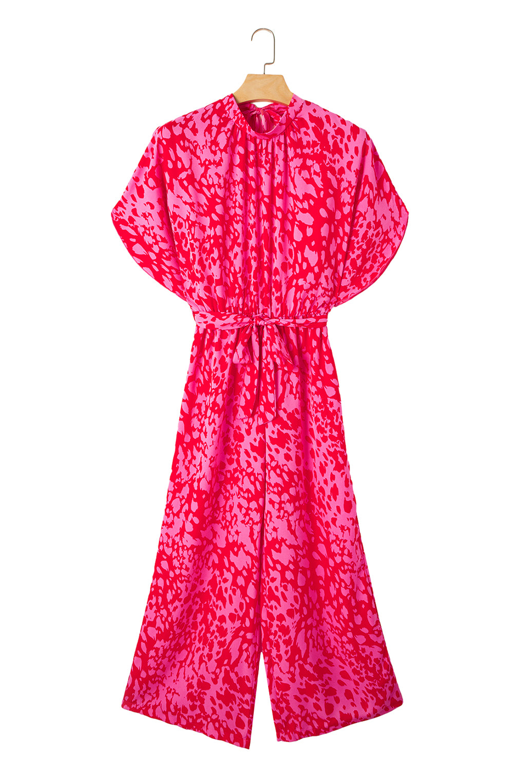 Pink patterned jumpsuit on a hanger against a white background