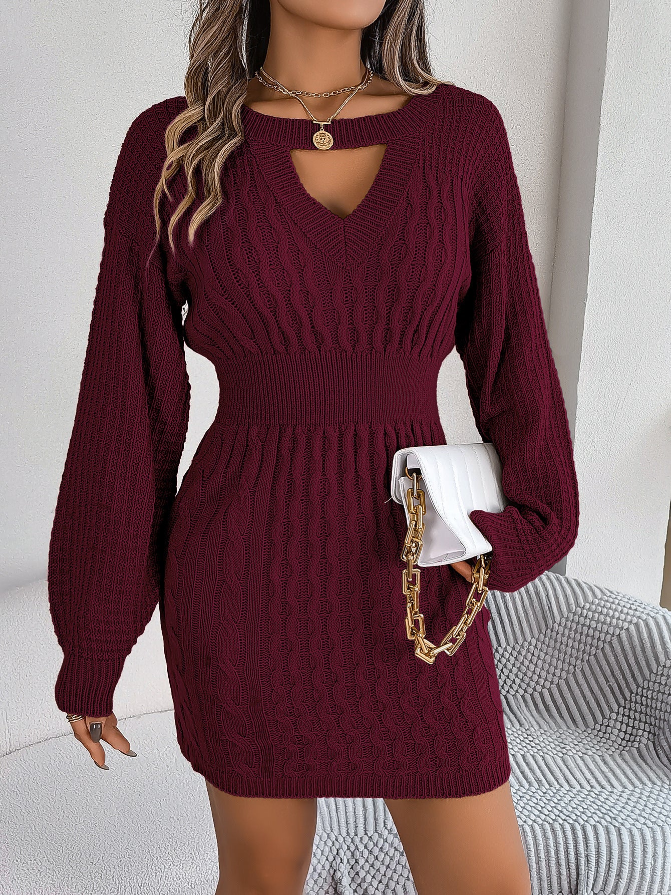 This sophisticated Womens Twist Hollow-out Lantern Sleeve Sweater Dress is crafted from premium, luxurious fabric and features a chic twist on a classic style. Fitted sleeves and a modern lantern hem create an elegant silhouette, while the delicate, intricate hollow-out detailing adds a touch of refinement. Be at the height of fashion with this timeless, effortlessly chic dress.