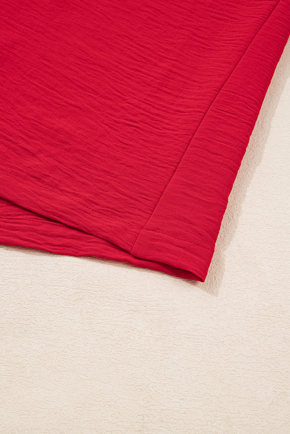 Red fabric on a beige background