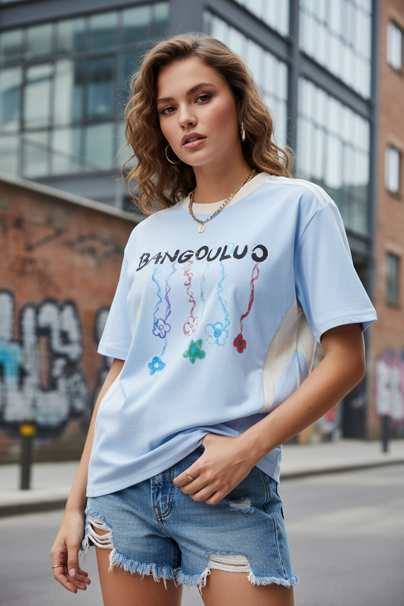Female model wearing a Baby Blue  "Bangouluo" Graphic Short Sleeve T-Shirt