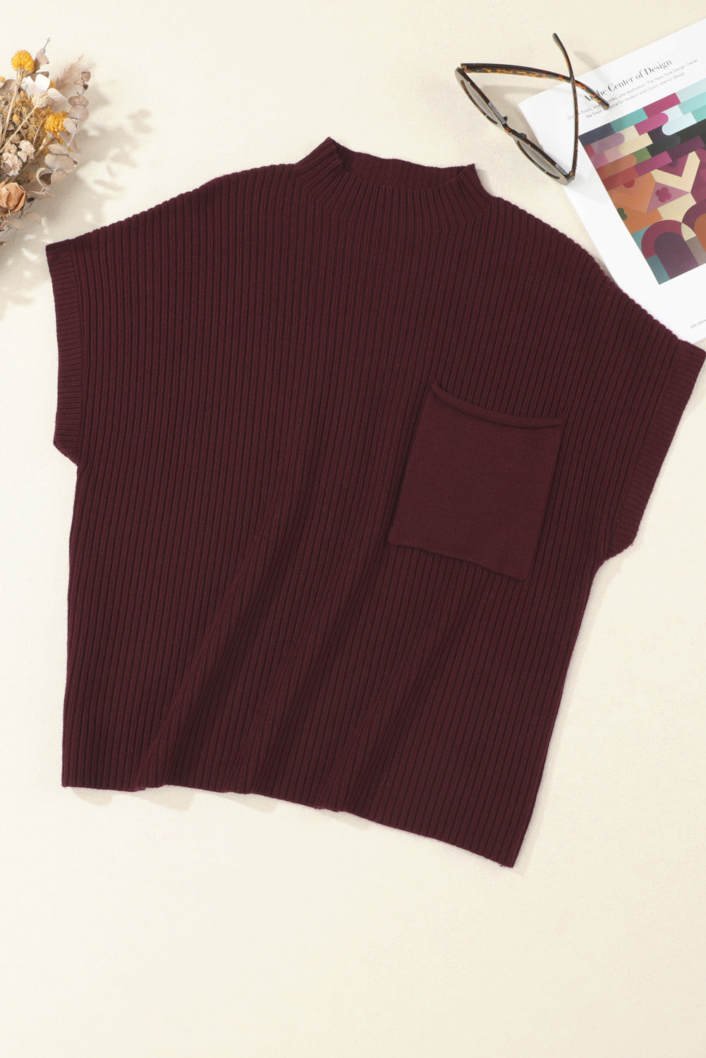 Brown ribbed sweater vest on a light background