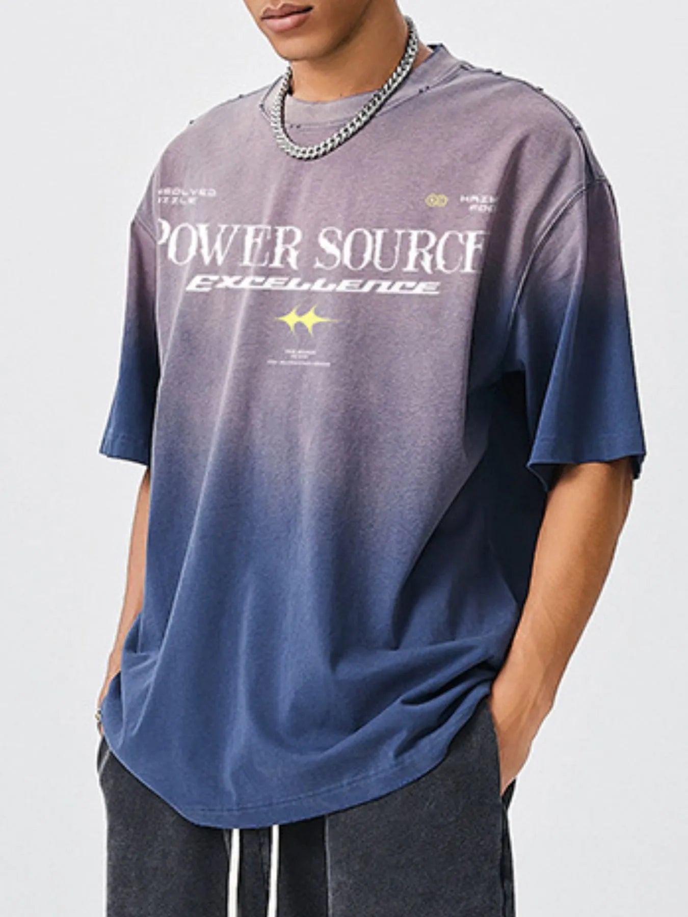 Male model wearing a sapphire blue  "Power Source Excellent" Graphic Short Sleeve T-Shirt side view
