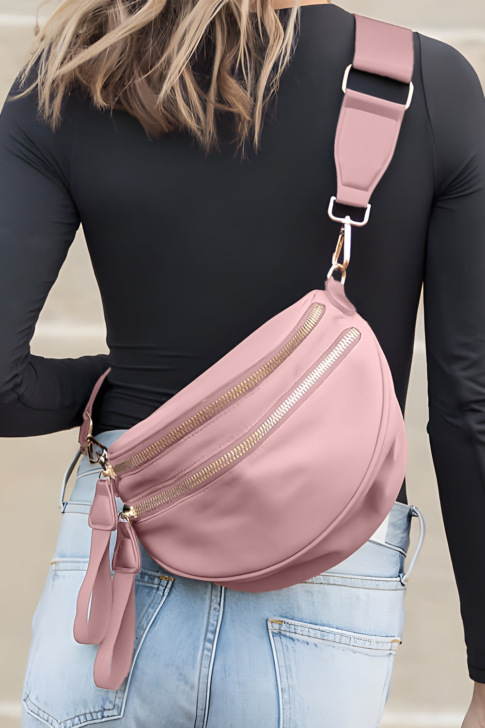 Model wearing a Women's pink Chic & Comfy Wide Strap Crossbody bag across the back