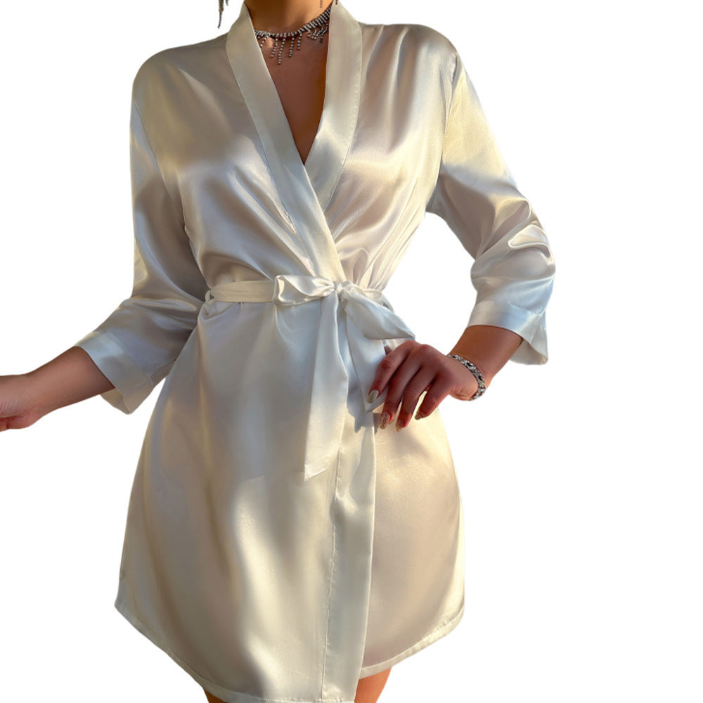 White satin robe worn by a person on a white background