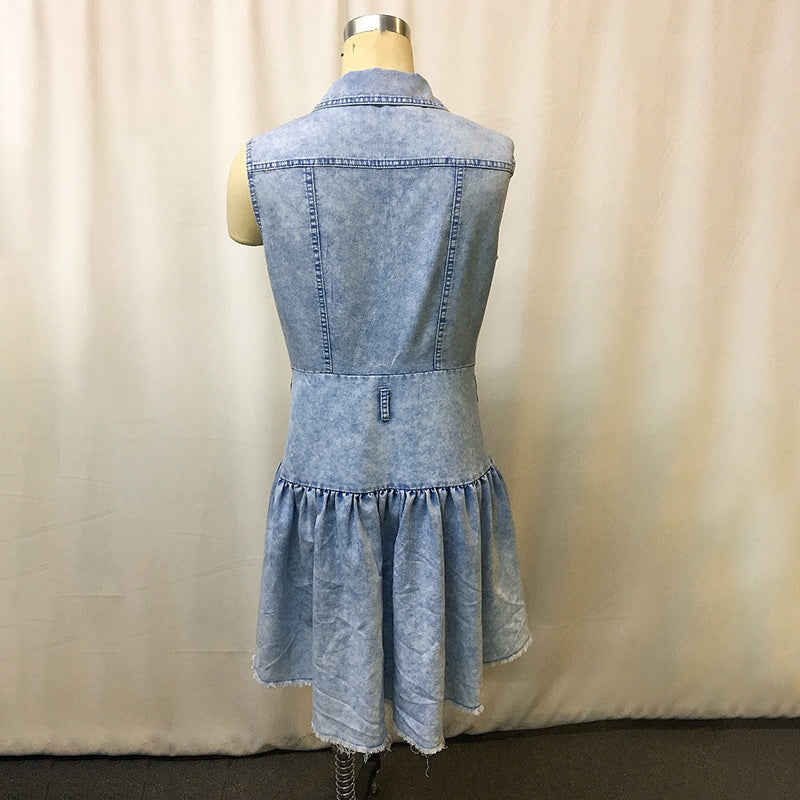 Denim dress on a mannequin against a beige curtain background back view