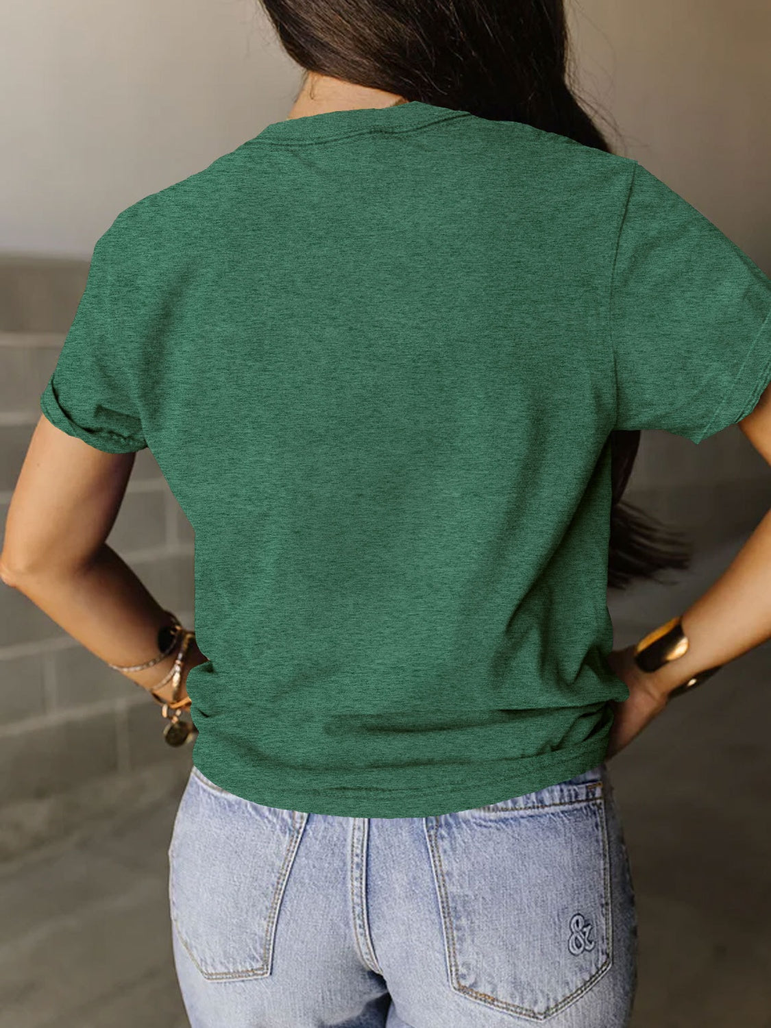 Back view of a Green Powered By The Black Women Before Me T-Shirt