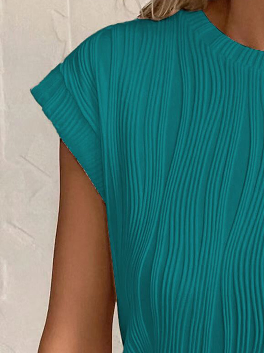 Close-up of textured fabric on Women's Teal Round Neck Cap Sleeve T-Shirt