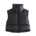 Black puffer vest on a white background