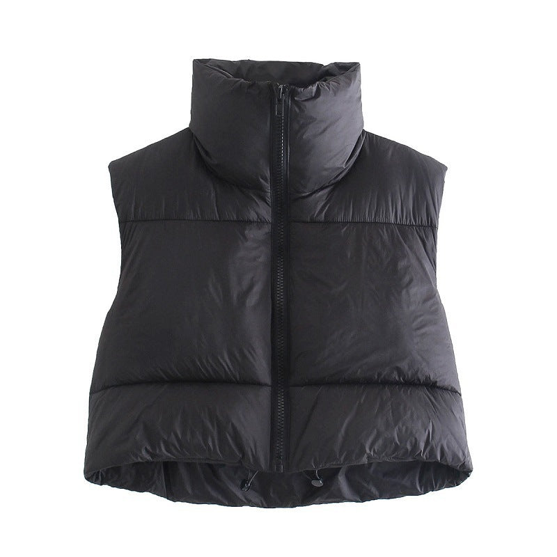 Black puffer vest on a white background