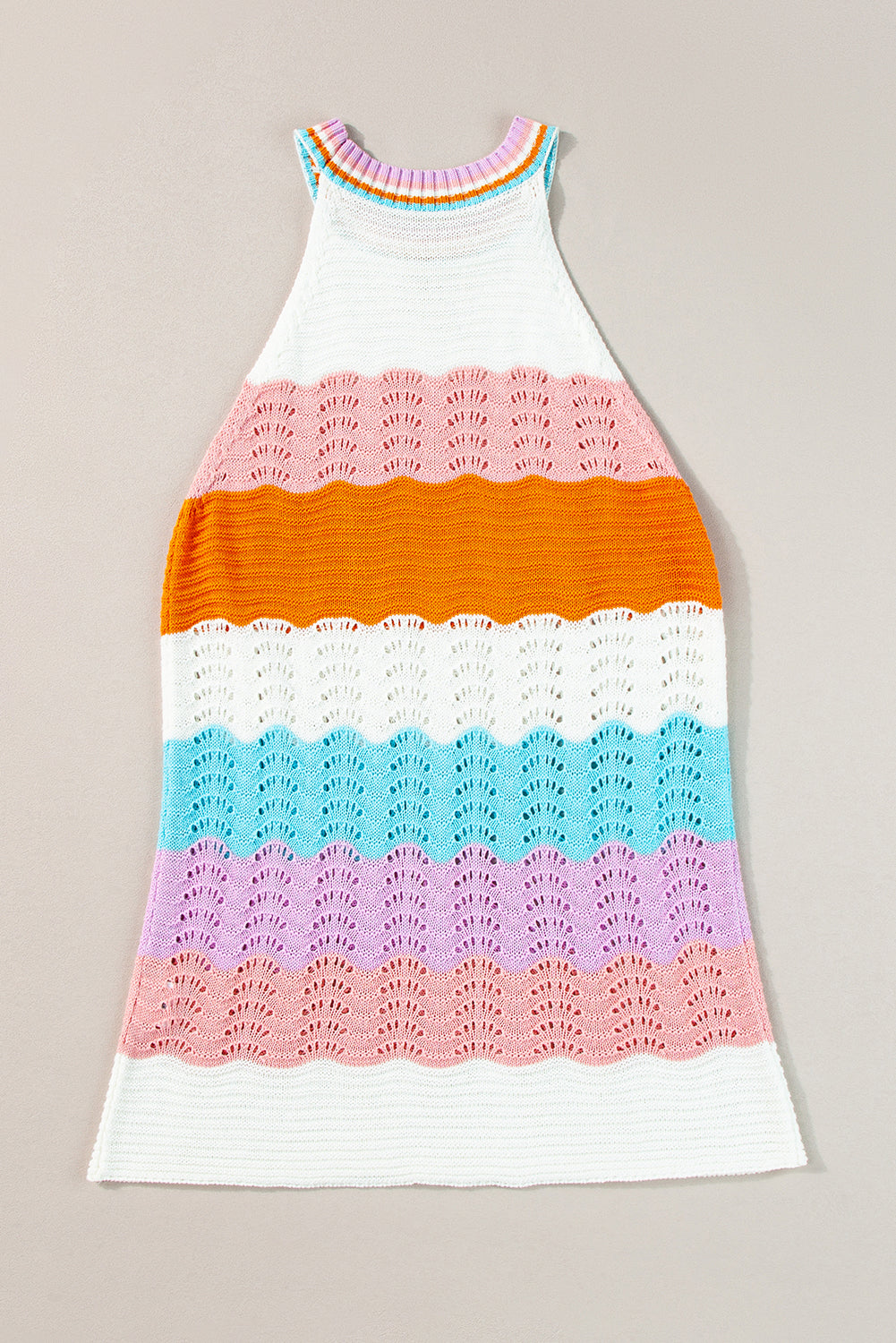 Colorful crochet dress with a gradient pattern on a beige background