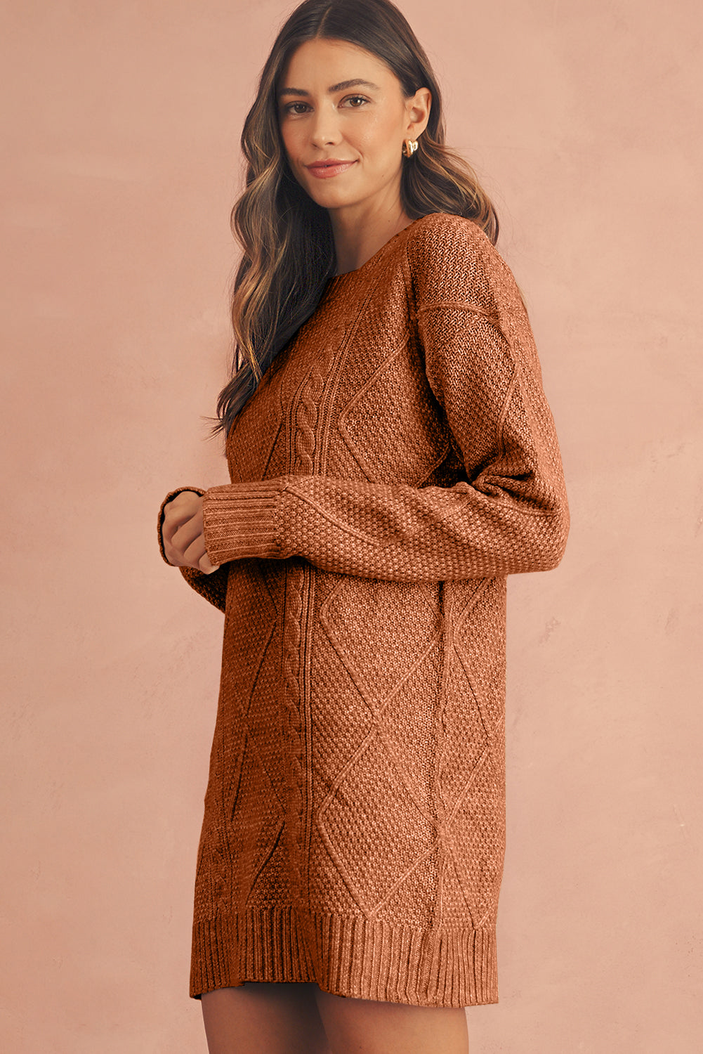 Woman wearing a brown knitted sweater dress side view