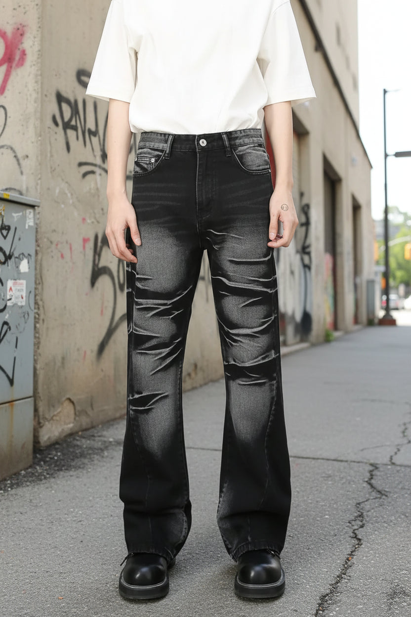 Male model wearing a pair of black acid washed Bootcut Jeans front view
