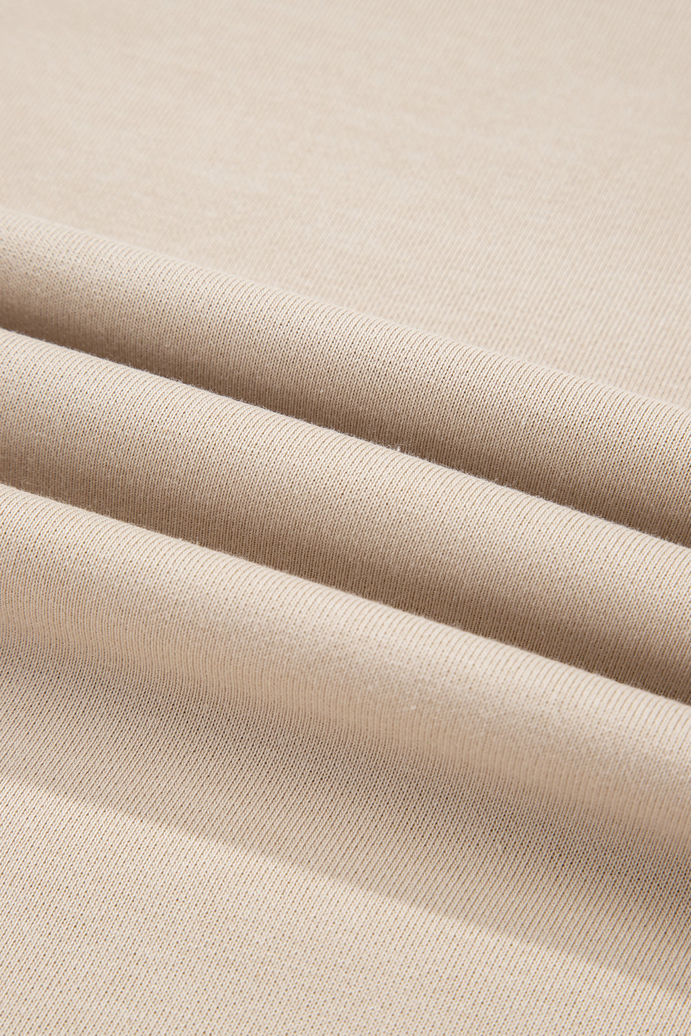 Close-up of beige fabric with visible texture