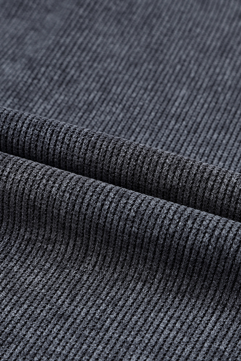 Close-up of dark gray textured fabric