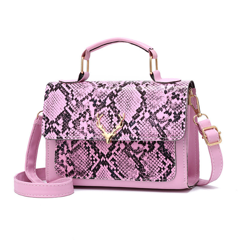 Pink handbag with snake print pattern on a white background