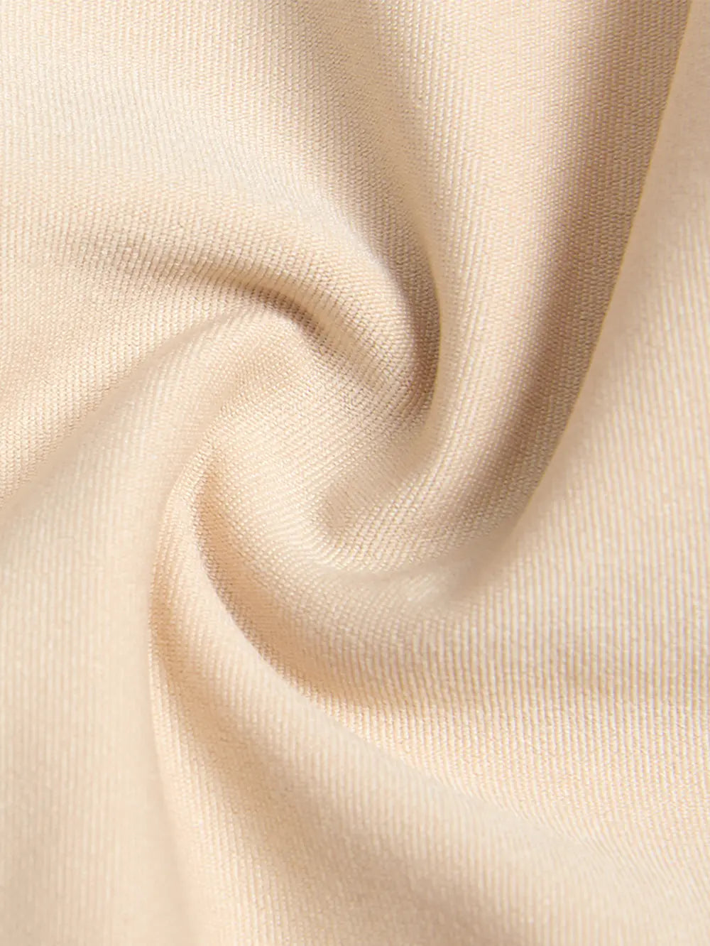 Close-up of beige fabric with a soft texture