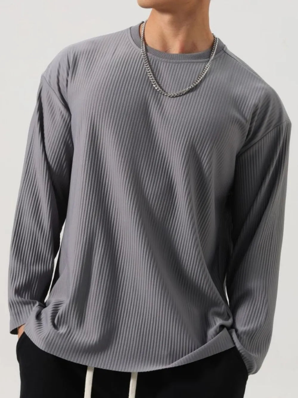 Person wearing a gray Men's Basic Ribbed Round Neck Long Sleeve T-Shirt