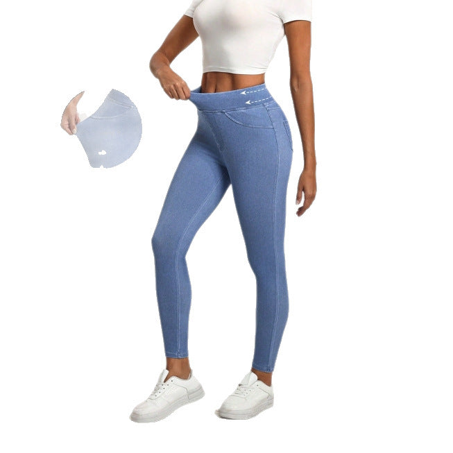 Person wearing blue leggings with a white background