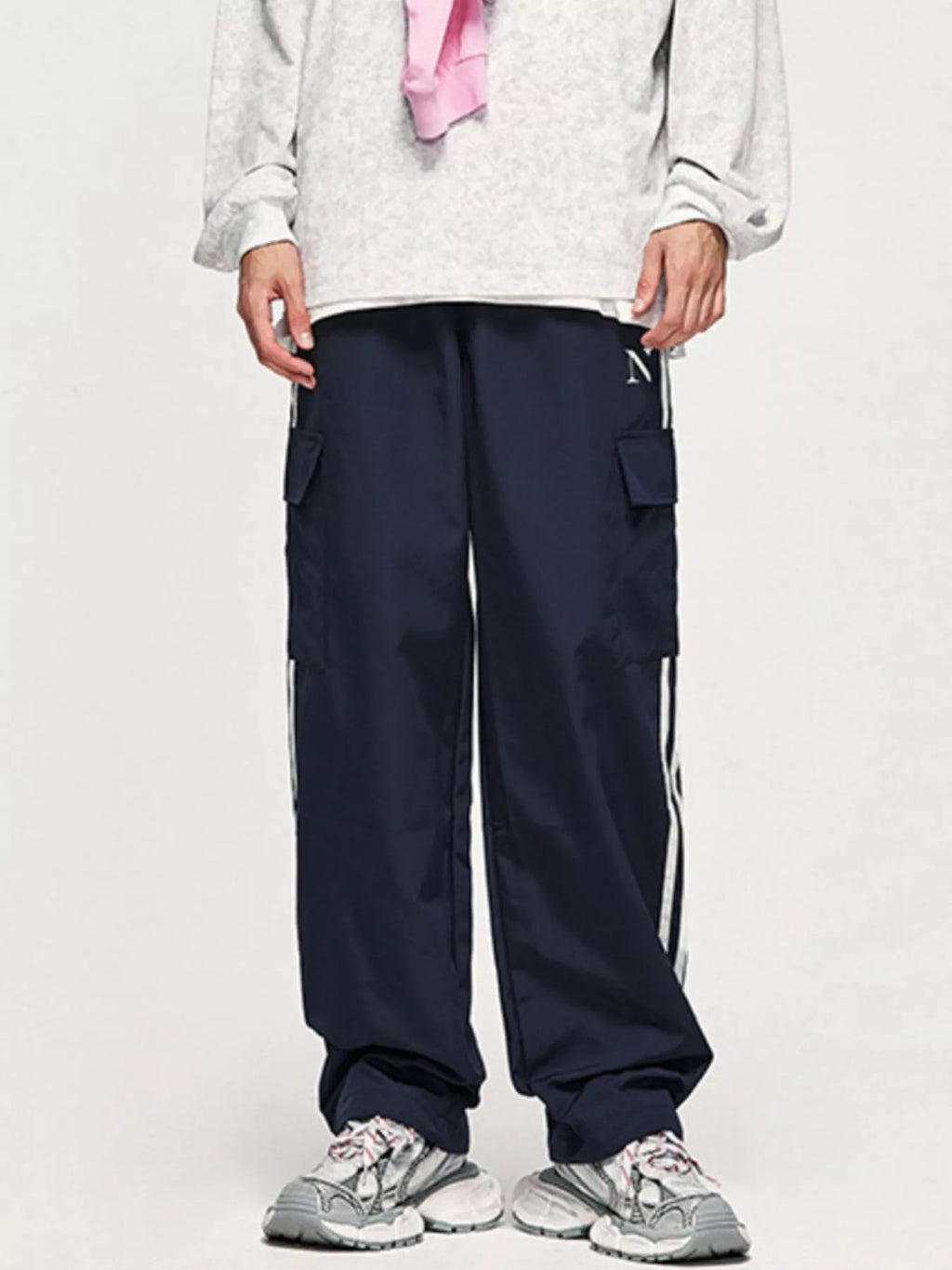 Model wearing royal blue Men's Side Striped Cargo Pants